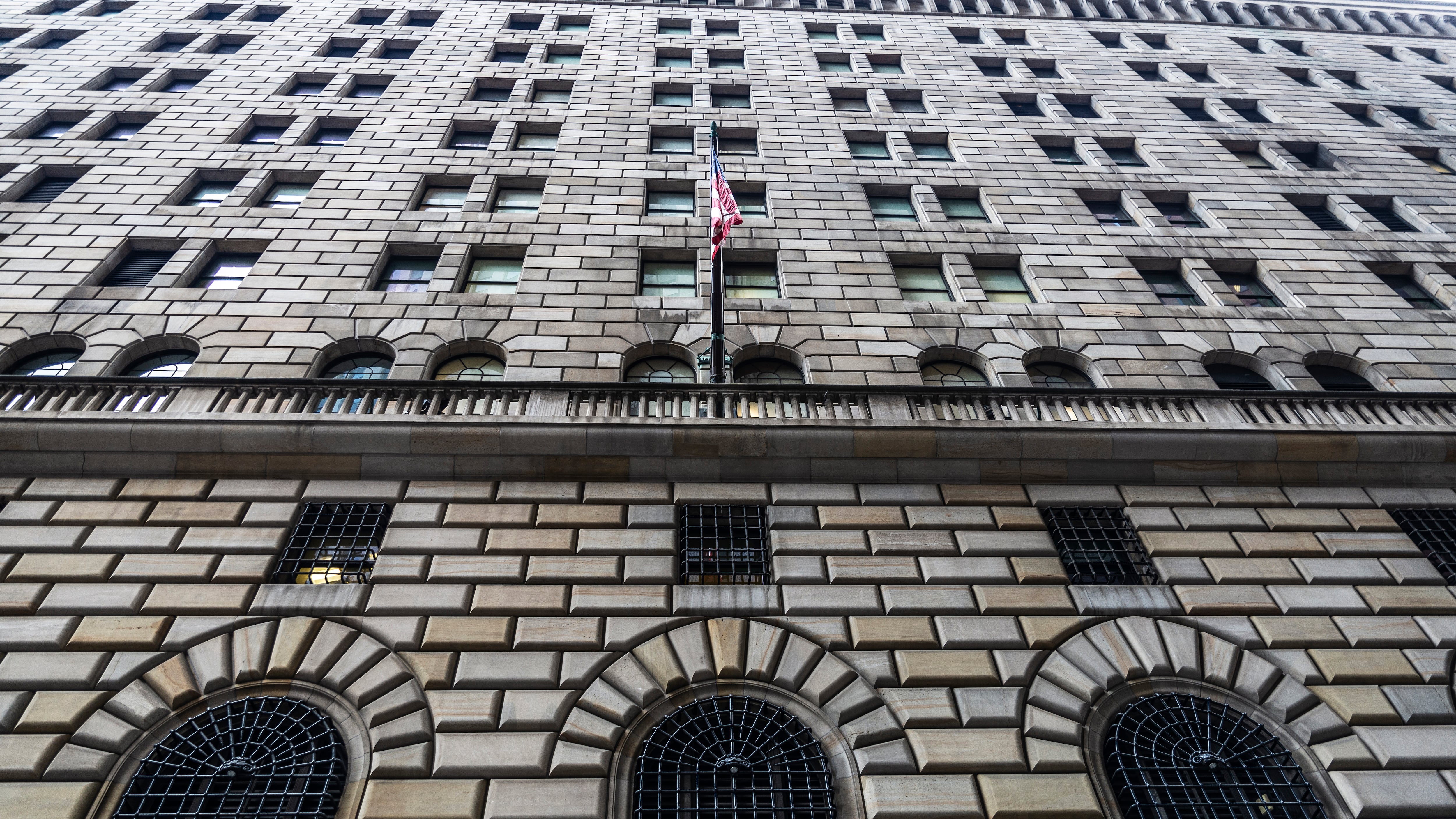 Fed reduces benchmark rate another 0.25 points, halves number of expected 2025 cuts 