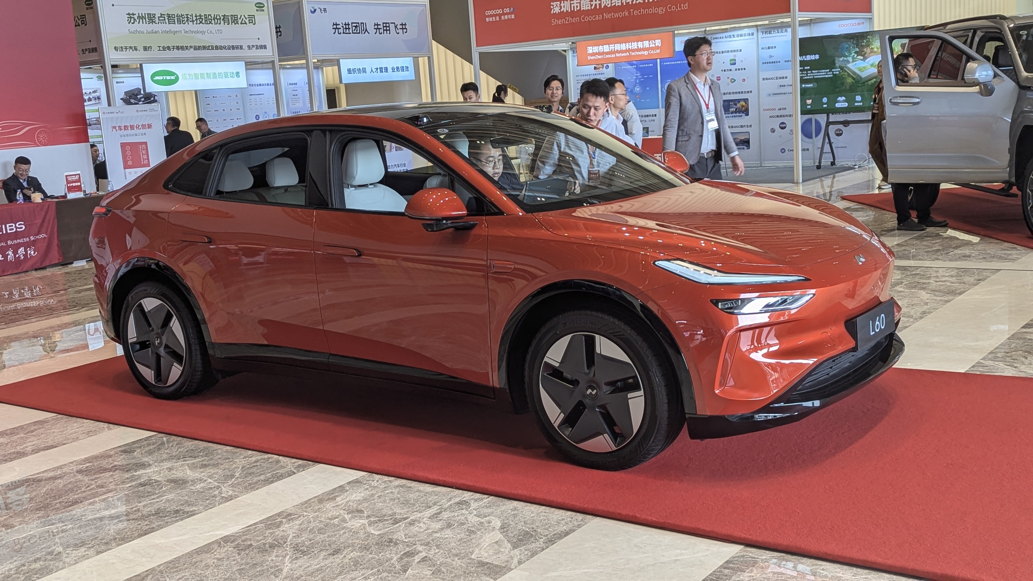 An orange coupe-style SUV